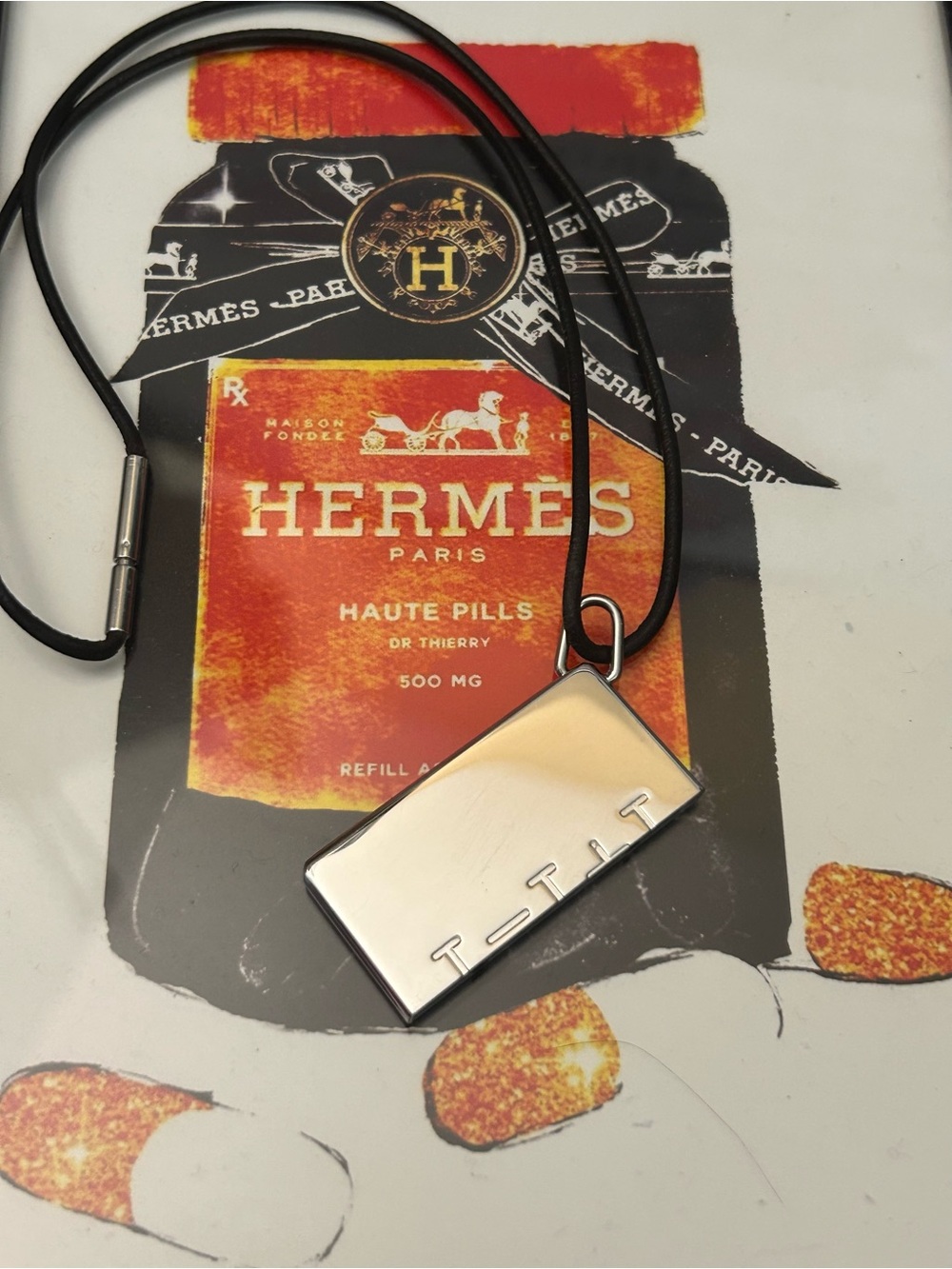 Hermés Symbolé 1+1=1 (bottom) Silver Pendant Necklace with Black Leather Cord